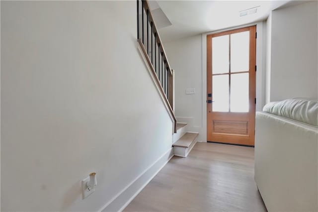 455 Saddle Bow Dr, Lawrenceville, GA 30046 - entryway featuring stairs, light wood-style flooring, and baseboards