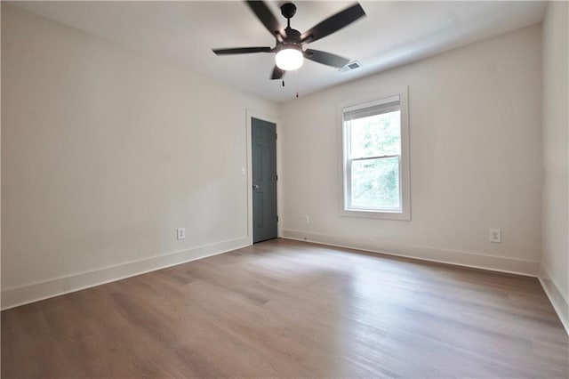 455 Saddle Bow Dr, Lawrenceville, GA 30046 - empty room featuring wood finished floors, baseboards, and a ceiling fan