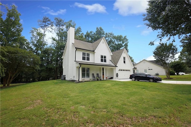 455 Saddle Bow Dr, Lawrenceville, GA 30046 - view of front facade featuring a chimney, a garage, a front lawn, and driveway