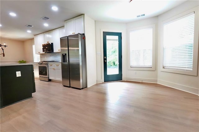 455 Saddle Bow Dr, Lawrenceville, GA 30046 - kitchen featuring stainless steel appliances, white cabinets, light wood-style flooring, recessed lighting, and baseboards