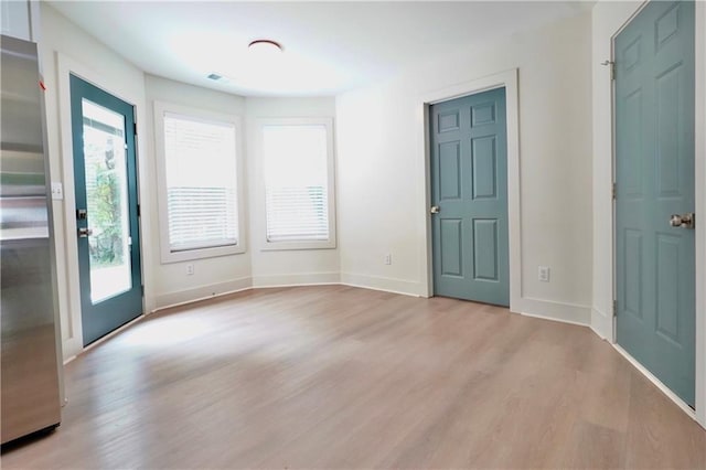 455 Saddle Bow Dr, Lawrenceville, GA 30046 - entrance foyer with wood finished floors, plenty of natural light, and baseboards