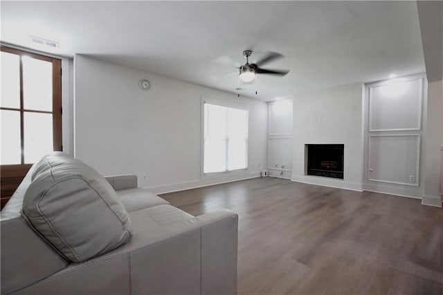 455 Saddle Bow Dr, Lawrenceville, GA 30046 - living area with a ceiling fan, wood finished floors, a fireplace, and baseboards