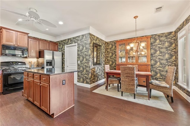 4535 Vanadium Bnd, Cumming, GA 30040 - kitchen featuring black appliances, wallpapered walls, baseboards, dark wood finished floors, and ornamental molding