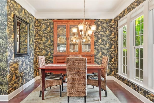 4535 Vanadium Bnd, Cumming, GA 30040 - dining space featuring wallpapered walls, baseboards, a chandelier, ornamental molding, and wood finished floors