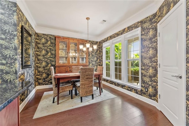 4535 Vanadium Bnd, Cumming, GA 30040 - dining space with wallpapered walls, baseboards, crown molding, dark wood-style flooring, and a chandelier