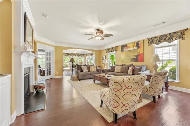 4535 Vanadium Bnd, Cumming, GA 30040 - living area with a ceiling fan, a high end fireplace, dark wood-style floors, baseboards, and ornamental molding
