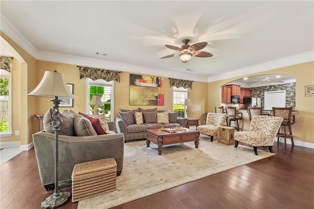 4535 Vanadium Bnd, Cumming, GA 30040 - living area with ceiling fan, healthy amount of natural light, hardwood / wood-style flooring, and crown molding