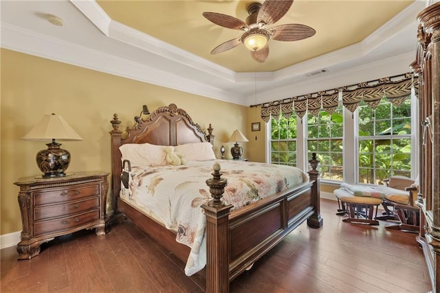 4535 Vanadium Bnd, Cumming, GA 30040 - bedroom with a tray ceiling, dark wood-type flooring, crown molding, a ceiling fan, and baseboards