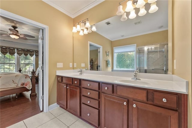 4535 Vanadium Bnd, Cumming, GA 30040 - full bathroom with double vanity, connected bathroom, crown molding, a ceiling fan, and tile patterned flooring