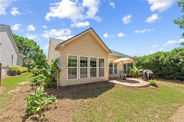 4535 Vanadium Bnd, Cumming, GA 30040 - back of property featuring a patio area and a lawn