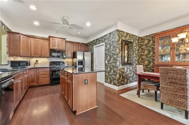 4535 Vanadium Bnd, Cumming, GA 30040 - kitchen with black appliances, ornamental molding, a kitchen island, a ceiling fan, and baseboards