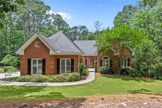 25 Highlands Way, Oxford, GA 30054 - view of front facade with brick siding, a front lawn, and a shingled roof