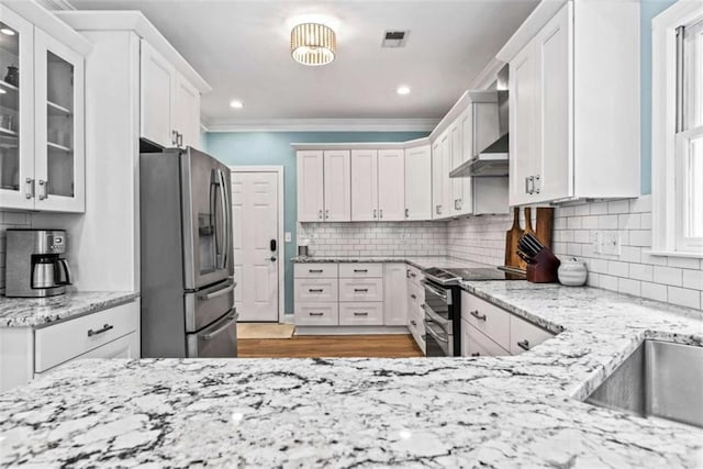 25 Highlands Way, Oxford, GA 30054 - kitchen with appliances with stainless steel finishes, ornamental molding, backsplash, white cabinetry, and recessed lighting