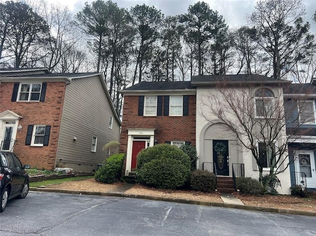 view of front of house featuring brick siding