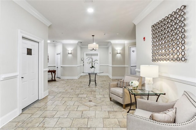 sitting room featuring ornamental molding, stone tile flooring, baseboards, and recessed lighting