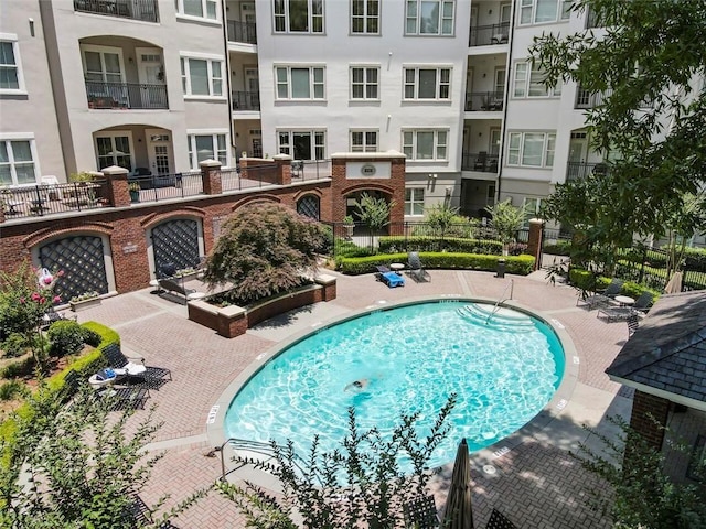 community pool with fence