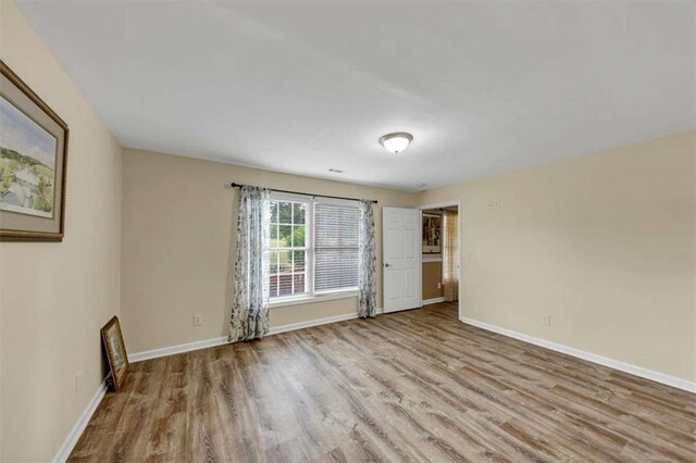 1131 Planing Mill Rd, Greensboro, GA 30642 - spare room with wood finished floors and baseboards
