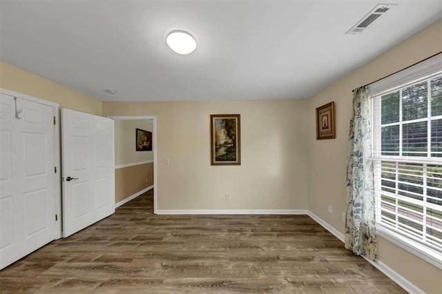 1131 Planing Mill Rd, Greensboro, GA 30642 - spare room featuring wood finished floors and baseboards