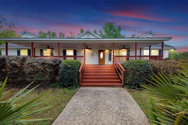 1131 Planing Mill Rd, Greensboro, GA 30642 - view of front of house with ceiling fan, covered porch, and stairway
