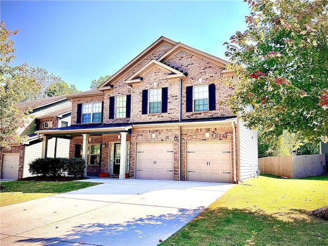 view of front of house featuring a front lawn and a garage