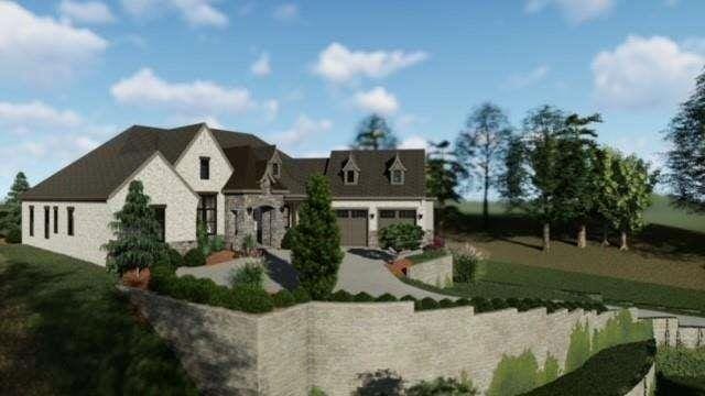 view of front of property featuring a garage, stone siding, and a front yard