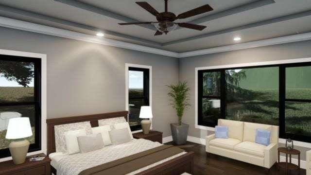 bedroom featuring baseboards, a tray ceiling, and recessed lighting