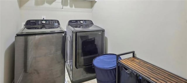 clothes washing area with washer and dryer