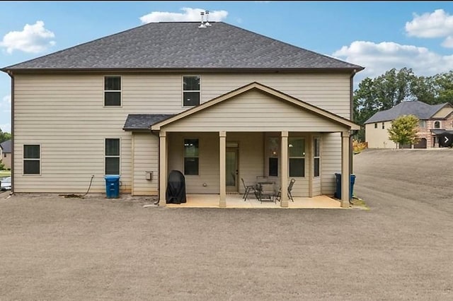 back of property featuring a patio