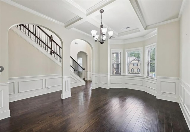 interior space featuring an inviting chandelier, coffered ceiling, dark hardwood / wood-style floors, and beamed ceiling