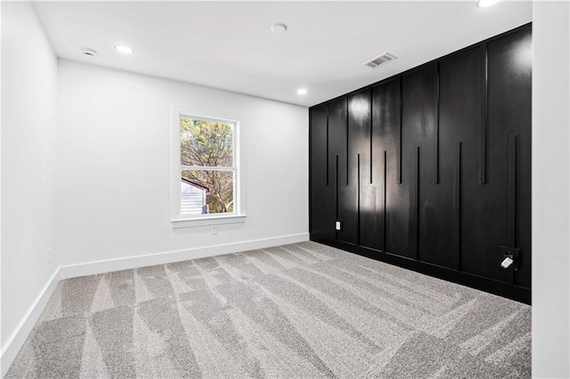 unfurnished bedroom with light colored carpet