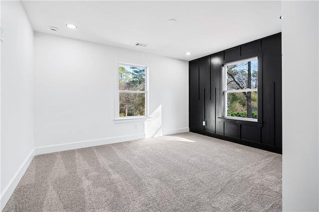 empty room featuring light carpet