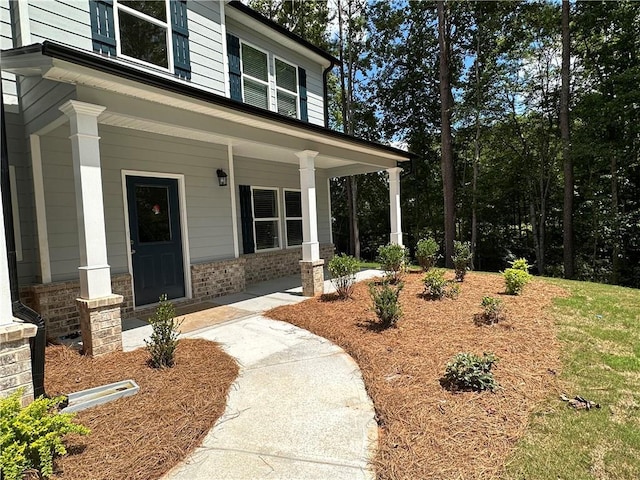 doorway to property with a porch