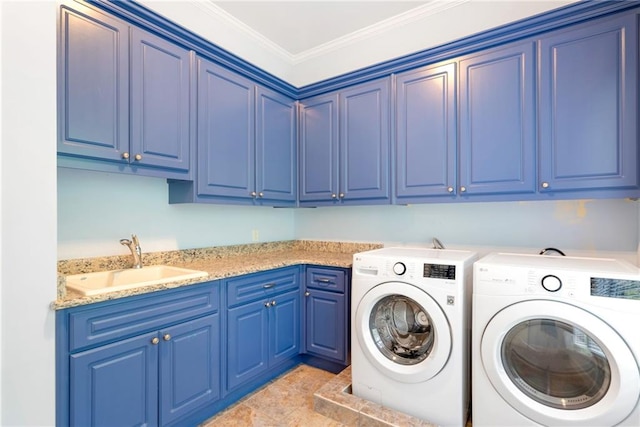 clothes washing area with cabinet space, washing machine and dryer, ornamental molding, and a sink