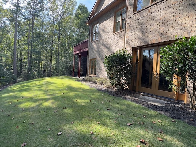 view of yard with french doors