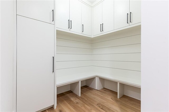 mudroom with light hardwood / wood-style flooring