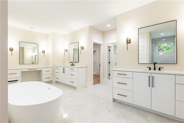 bathroom featuring vanity and a bathtub