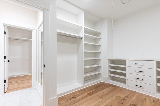 walk in closet featuring light wood-type flooring