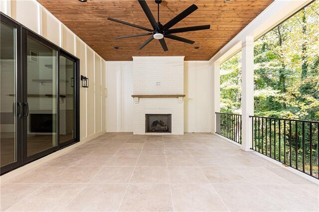 view of patio / terrace with ceiling fan and a balcony