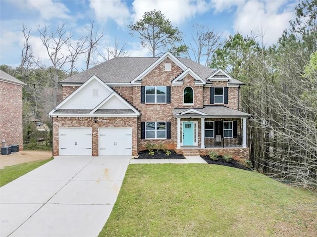 craftsman house featuring a shingled roof, a front lawn, a porch, concrete driveway, and a garage