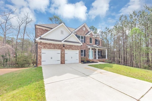 view of front of home with a front yard, a porch, concrete driveway, a garage, and brick siding