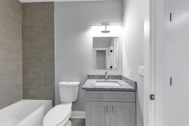 full bathroom with vanity, toilet, tub / shower combination, and baseboards