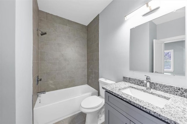 bathroom with vanity, tile patterned floors, toilet, and washtub / shower combination