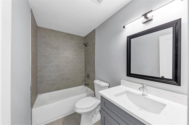 bathroom featuring toilet, shower / washtub combination, vanity, and tile patterned flooring