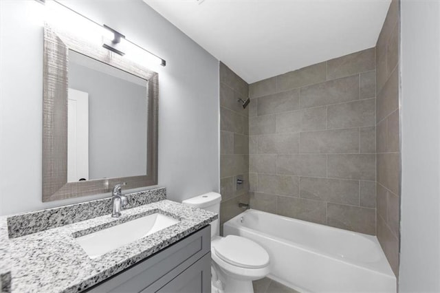 bathroom featuring vanity, toilet, and shower / tub combination