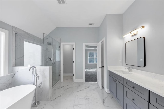 bathroom featuring a marble finish shower, visible vents, a soaking tub, marble finish floor, and vanity