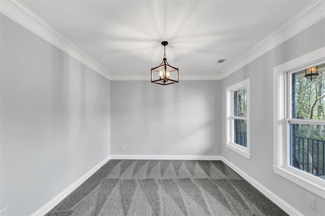 empty room featuring dark colored carpet, baseboards, a notable chandelier, and ornamental molding