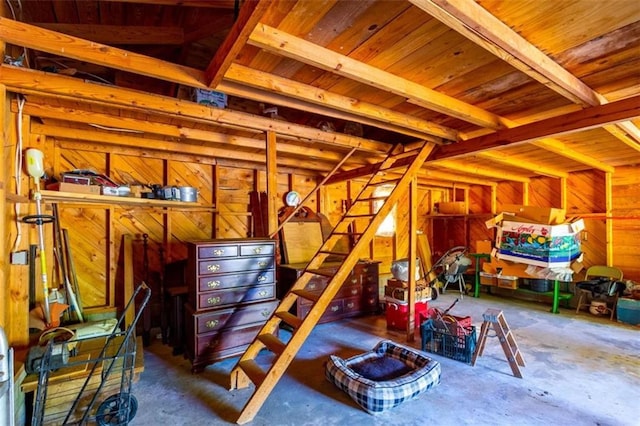 interior space featuring wood walls and wood ceiling
