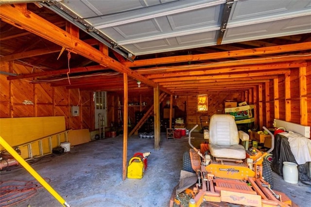 garage featuring wood walls