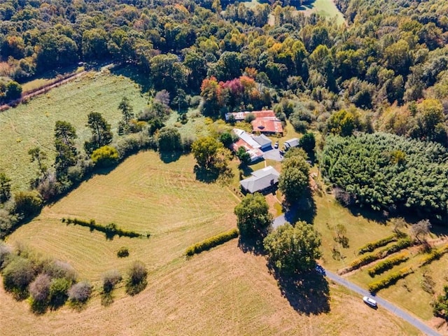 bird's eye view with a rural view and a wooded view