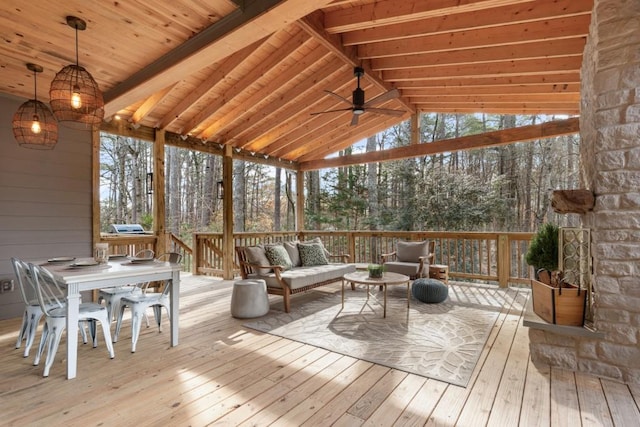 unfurnished sunroom with ceiling fan, wooden ceiling, and lofted ceiling with beams